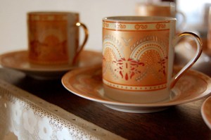 graphic of two coffee cups and saucers