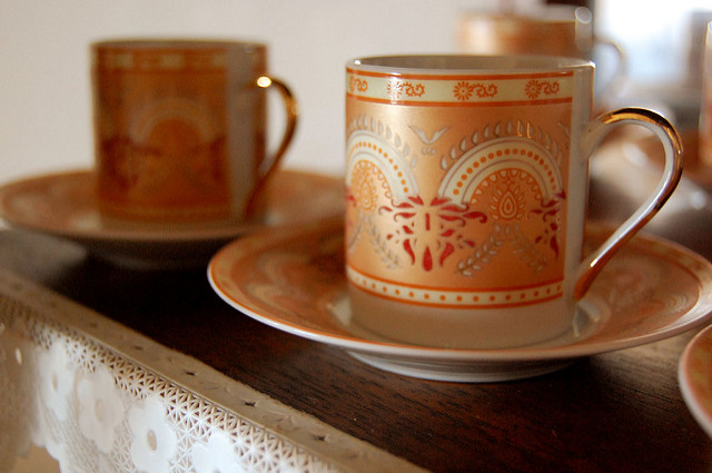 graphic of two coffee cups and saucers