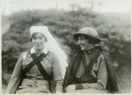 graphic is a black and white photo of two Canadian women wearing nurses uniforms from World War I